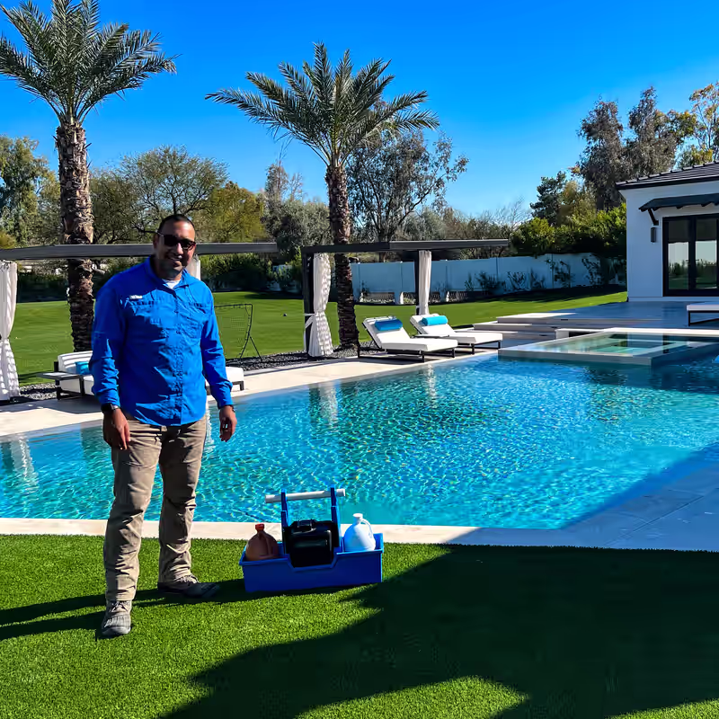Plumber smiling by the pool after completing service